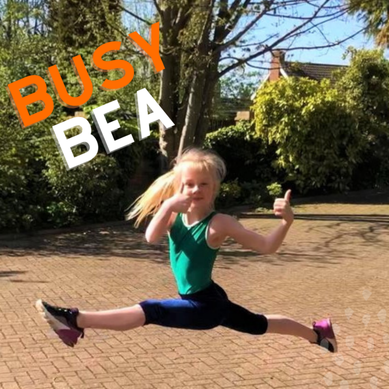 A ten-year old blonde girl with hair in a ponytail jumping mid air with the words 'Busy Bea' written by it